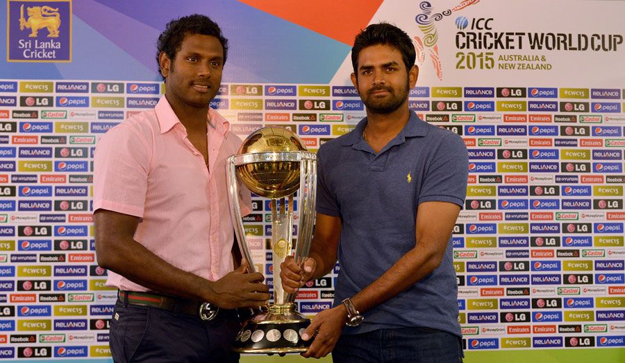 Angelo Mathews And Lahiru Thirimanne Pose With The 2015 World Cup Trophy